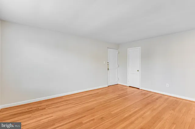 a kitchen with a stove and white cabinets
