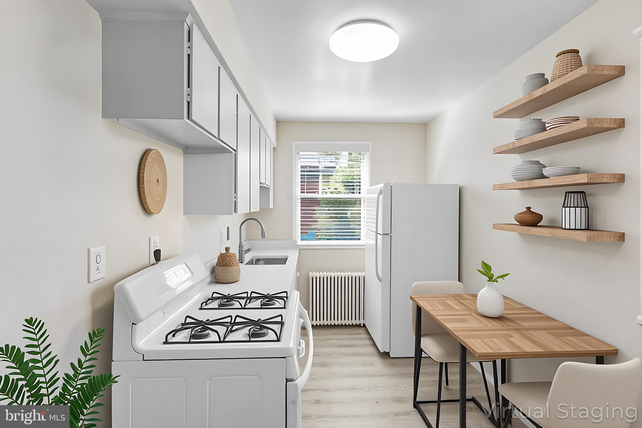 1404 12th Street North, Unit 32 Arlington, VA 22209 - Photo 10 of 26 a kitchen with stainless steel appliances granite countertop a stove a sink dishwasher a dining table and chairs with wooden floor