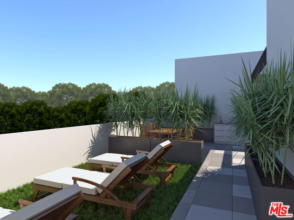 160 Chestnut Street, Unit 204 Pasadena, CA 91103 - Photo 19 of 22 a view of a patio with couches table and chairs with potted plants