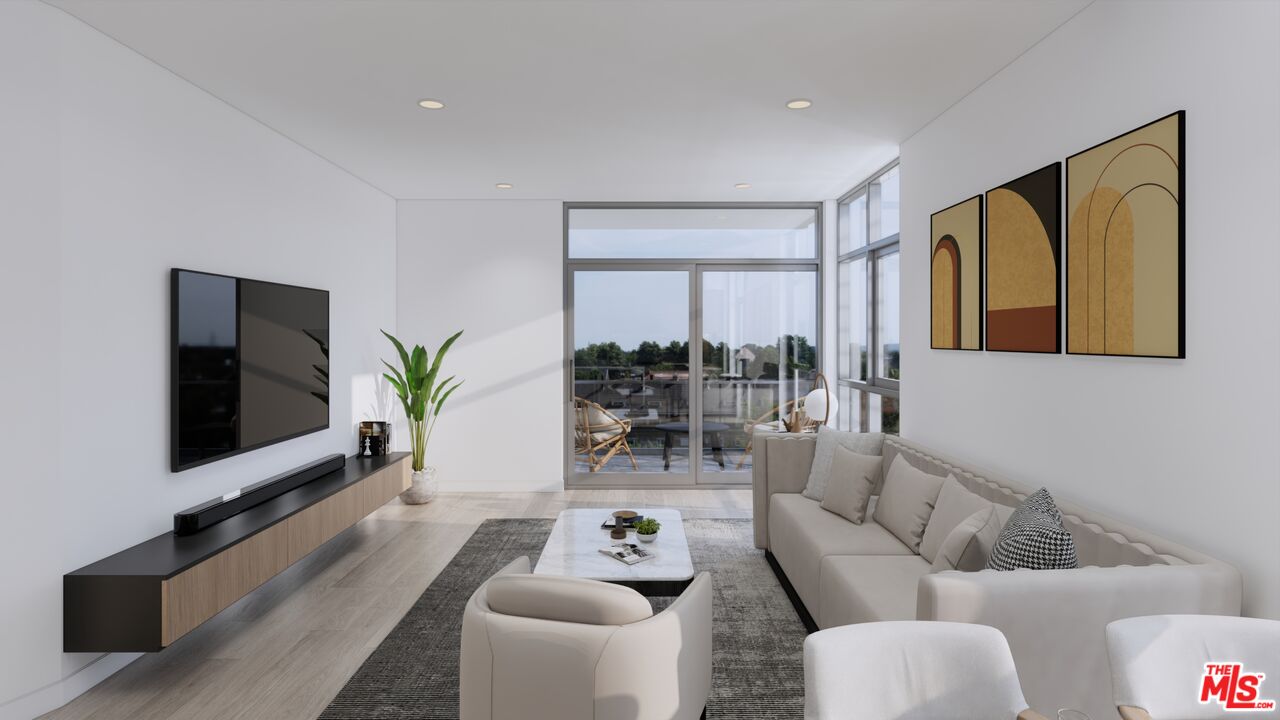 160 Chestnut Street, Unit 204 Pasadena, CA 91103 - Photo 5 of 22 a living room with furniture and a flat screen tv