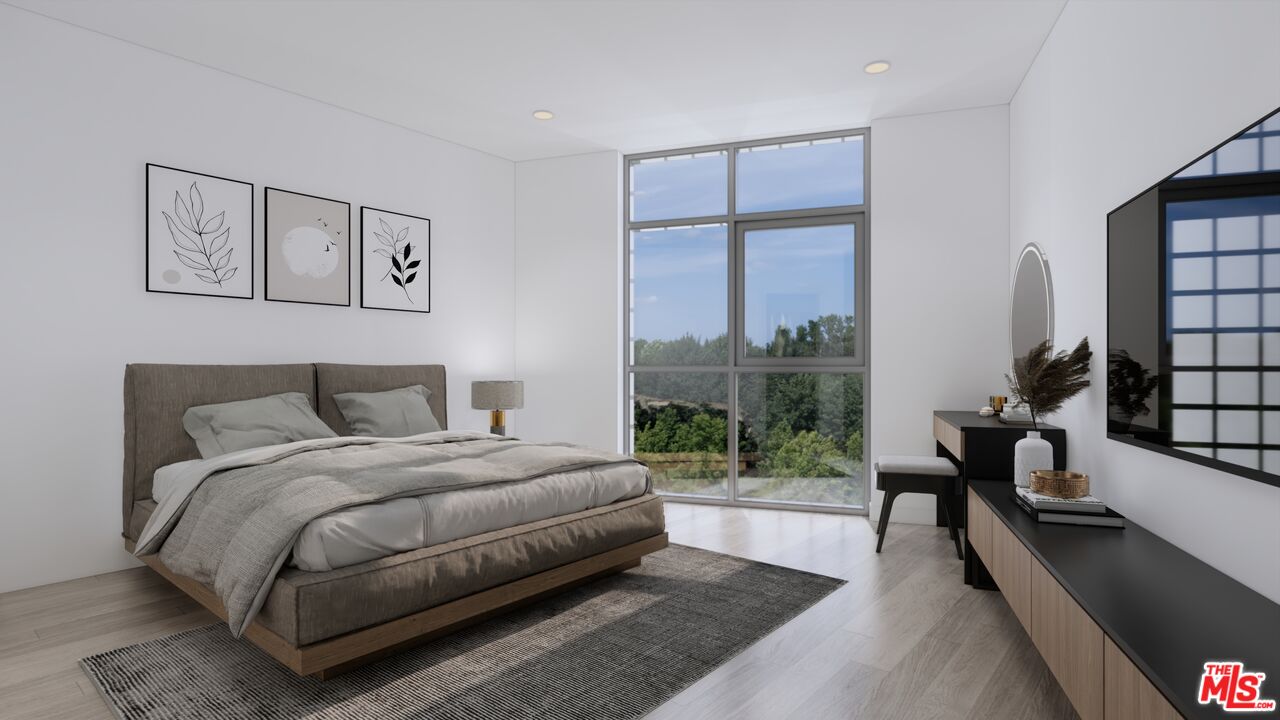 160 Chestnut Street, Unit 204 Pasadena, CA 91103 - Photo 7 of 22 a bedroom with a bed and a large window