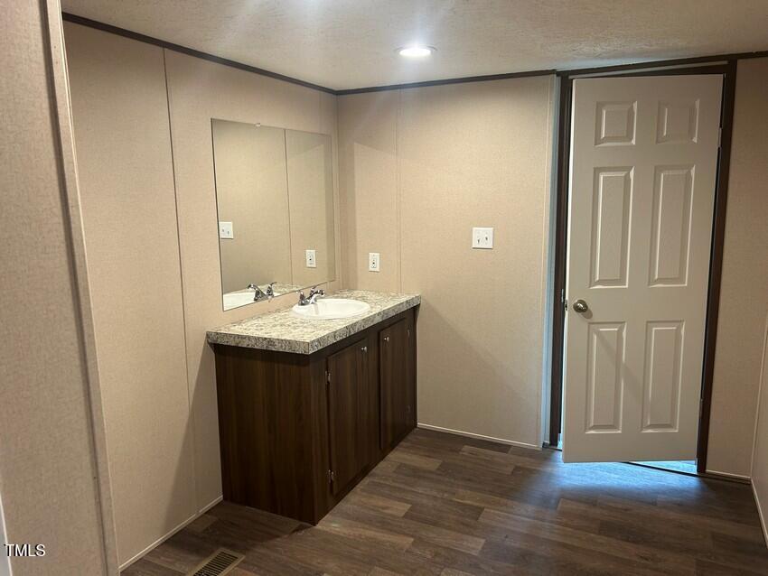 3356 North McCullen Road Faison, NC 28341 - Photo 16 of 25 a bathroom with a sink and a mirror