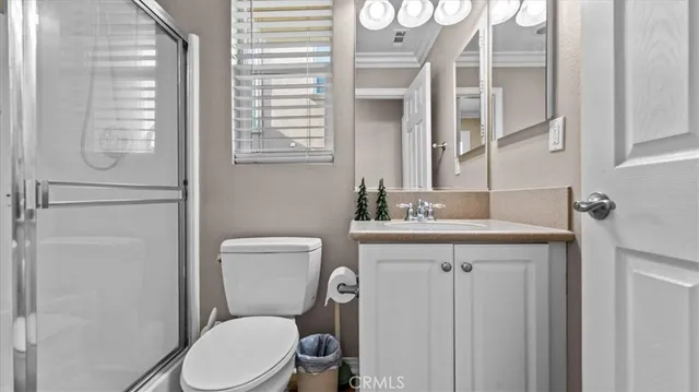 a spacious bedroom with a bed and a window