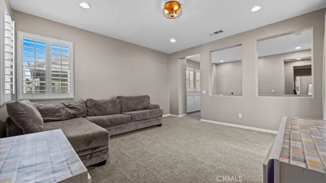 a spacious bathroom with a granite countertop sink mirror and shower