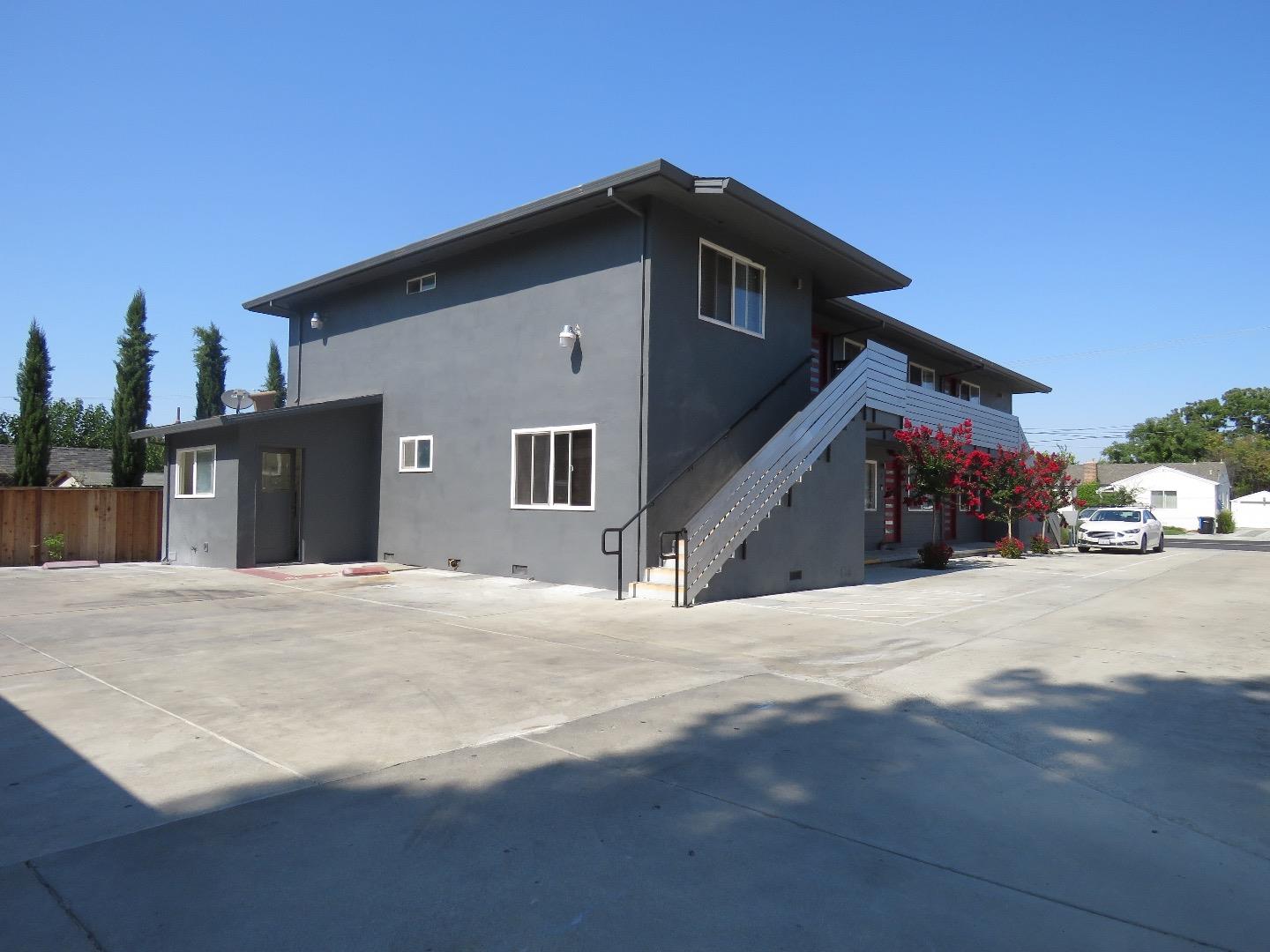 2062 Main Street Santa Clara, CA 95050 - Photo 18 of 18 a yellow house with trees in front of it