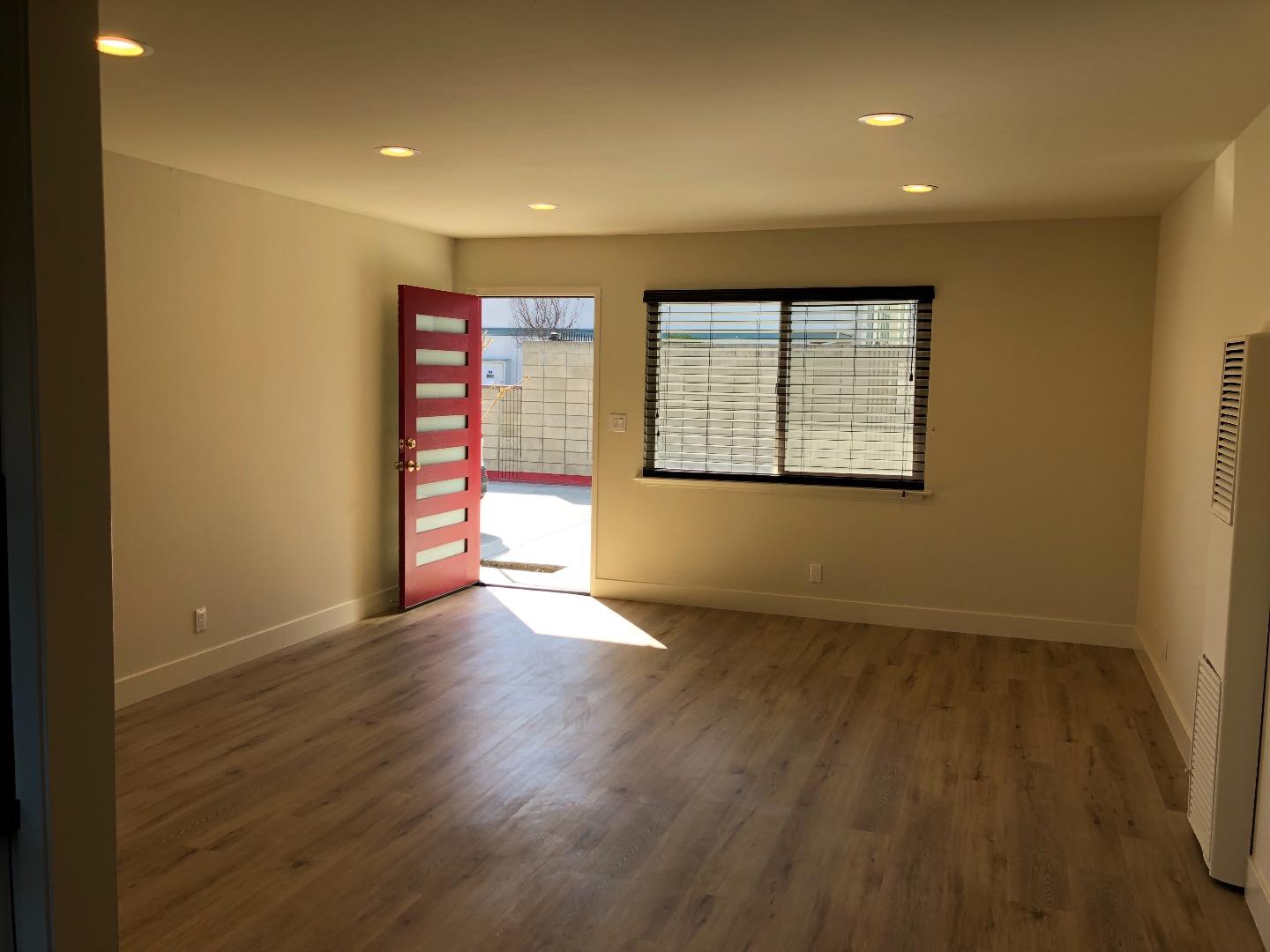 2062 Main Street Santa Clara, CA 95050 - Photo 7 of 18 an empty room with wooden floor and a window