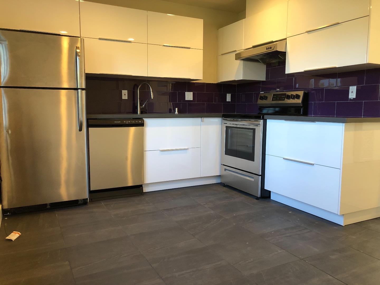 2062 Main Street Santa Clara, CA 95050 - Photo 9 of 18 a view of a refrigerator and a utility room with washer and dryer