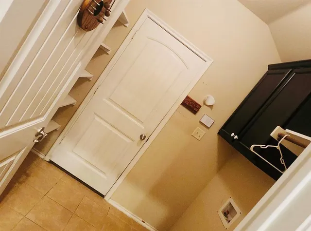 a blue swimming pool is in front of a house