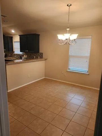 an empty room with a fireplace