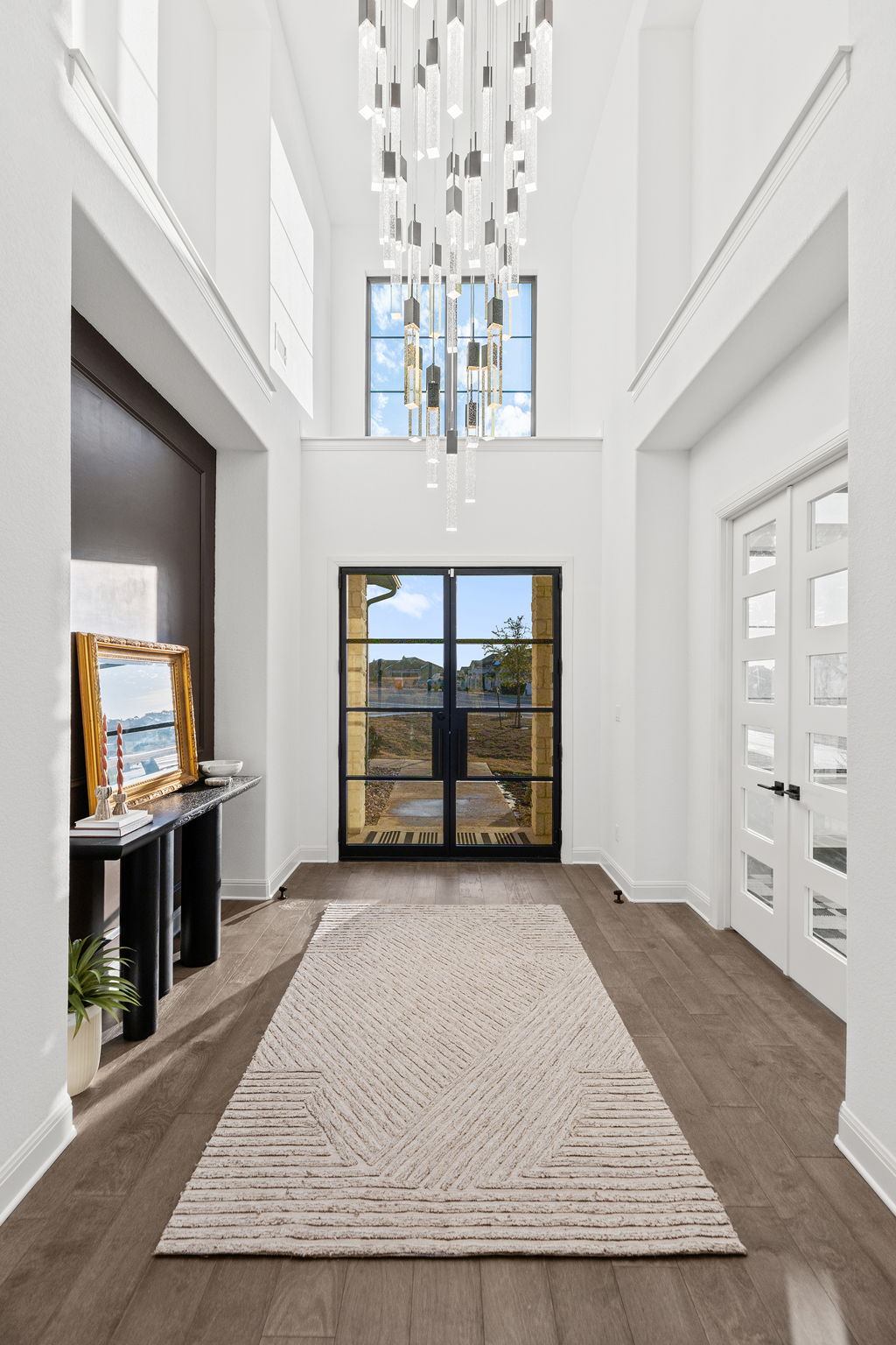 439 Wellborn Road Liberty Hill, TX 78642 - Photo 8 of 40 2 story foyer featuring beautiful crystal chandelier