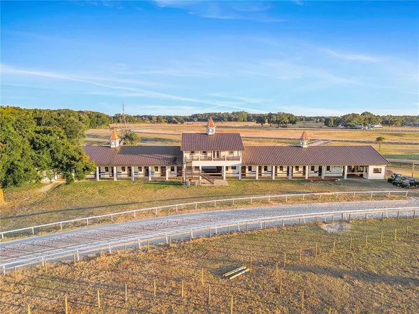 a view of a dining room with furniture and window