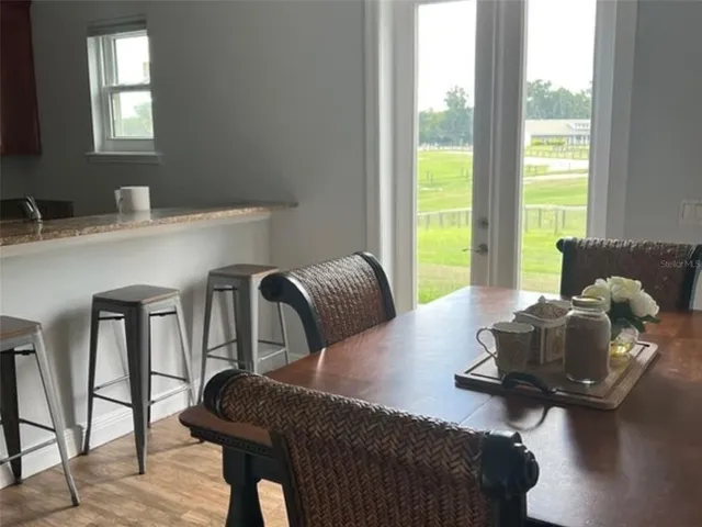 a view of a swimming pool with an outdoor seating