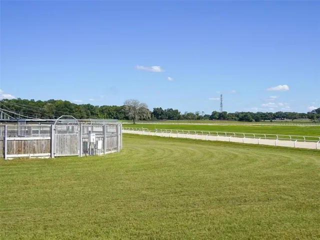 a view of a lake with houses in the background