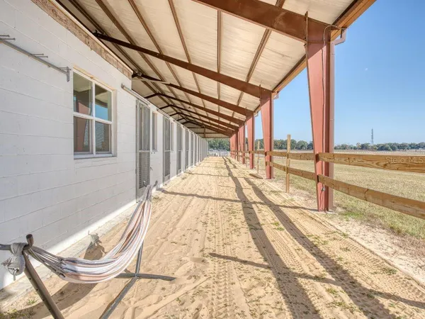 a view of an house with backyard and a garden