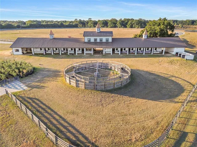 a view of swimming pool with outdoor seating and lake view