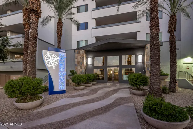 a front view of a building with garden