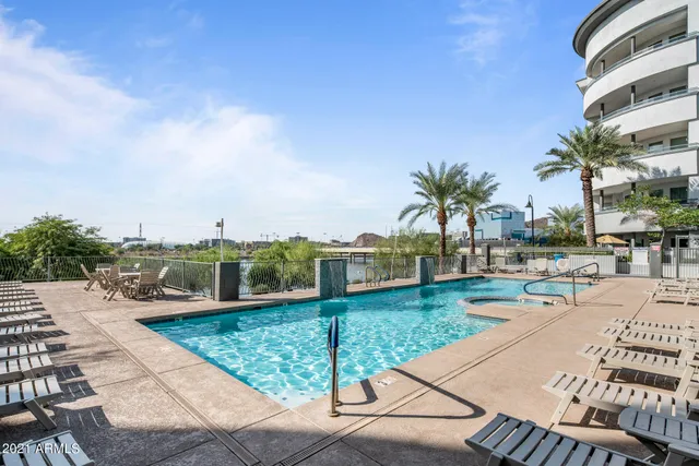 a view of a swimming pool with a lounge chairs