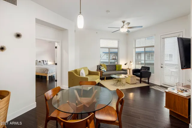 a living room with fireplace furniture and a flat screen tv