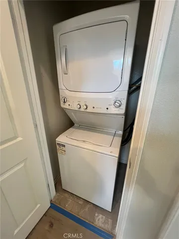 a view of a kitchen counter space and wooden floor