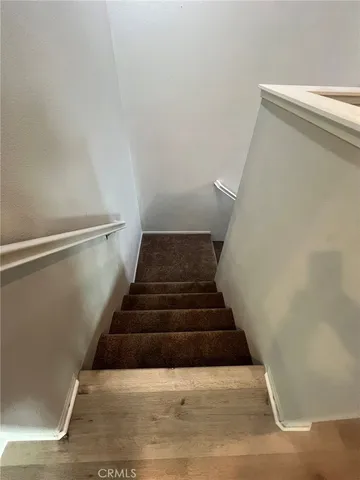 a kitchen with granite countertop wooden cabinets and a stainless steel appliances