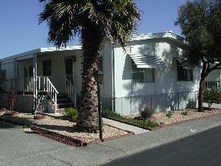 82 Shamrock Circle, Unit 82 Santa Rosa, CA 95403 - Photo 1 of 3 a front view of a house with a yard