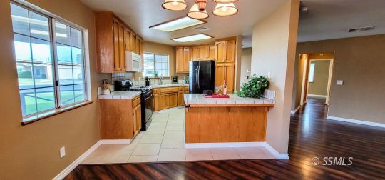 705 Ginger Avenue Ridgecrest, CA 93555 - Photo 7 of 21 a view of a living room and dining room