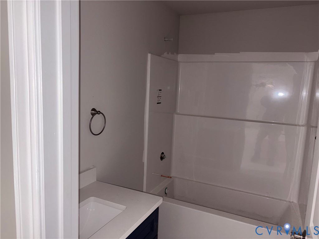 24178 Cabin Point Road Waverly, VA 23890 - Photo 10 of 14 a bathroom with a shower and a sink