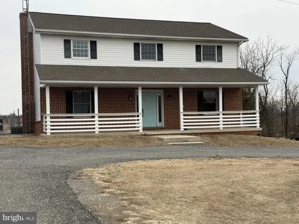 a house with trees in front of it