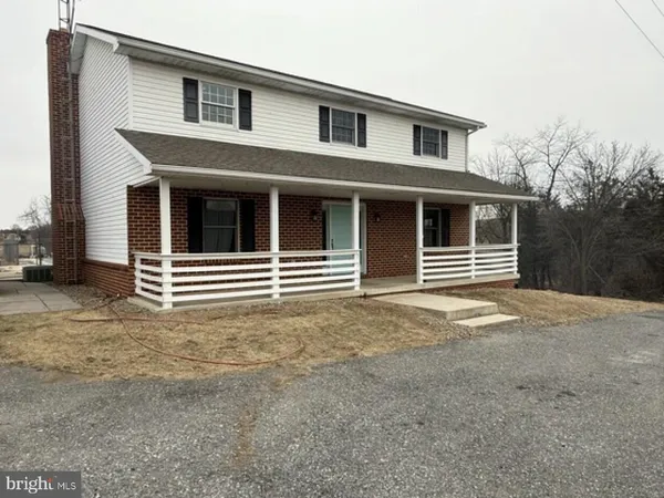 a house with trees in front of it