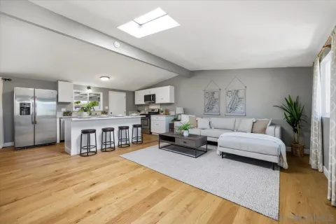 a living room with furniture and a table