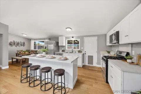 a kitchen with a table and chairs in it