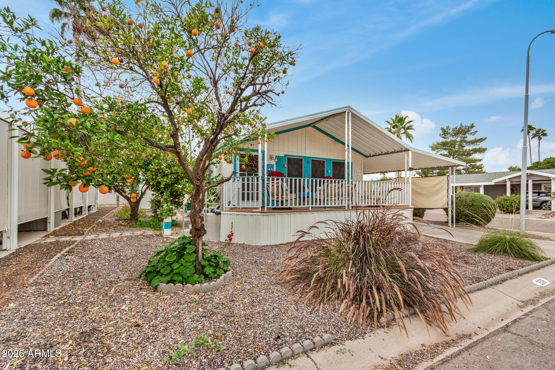 201 South Greenfield Road, Unit 239 Mesa, AZ 85206 - Photo 11 of 32 a view of a house with a yard
