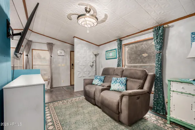 a living room with furniture and a rug