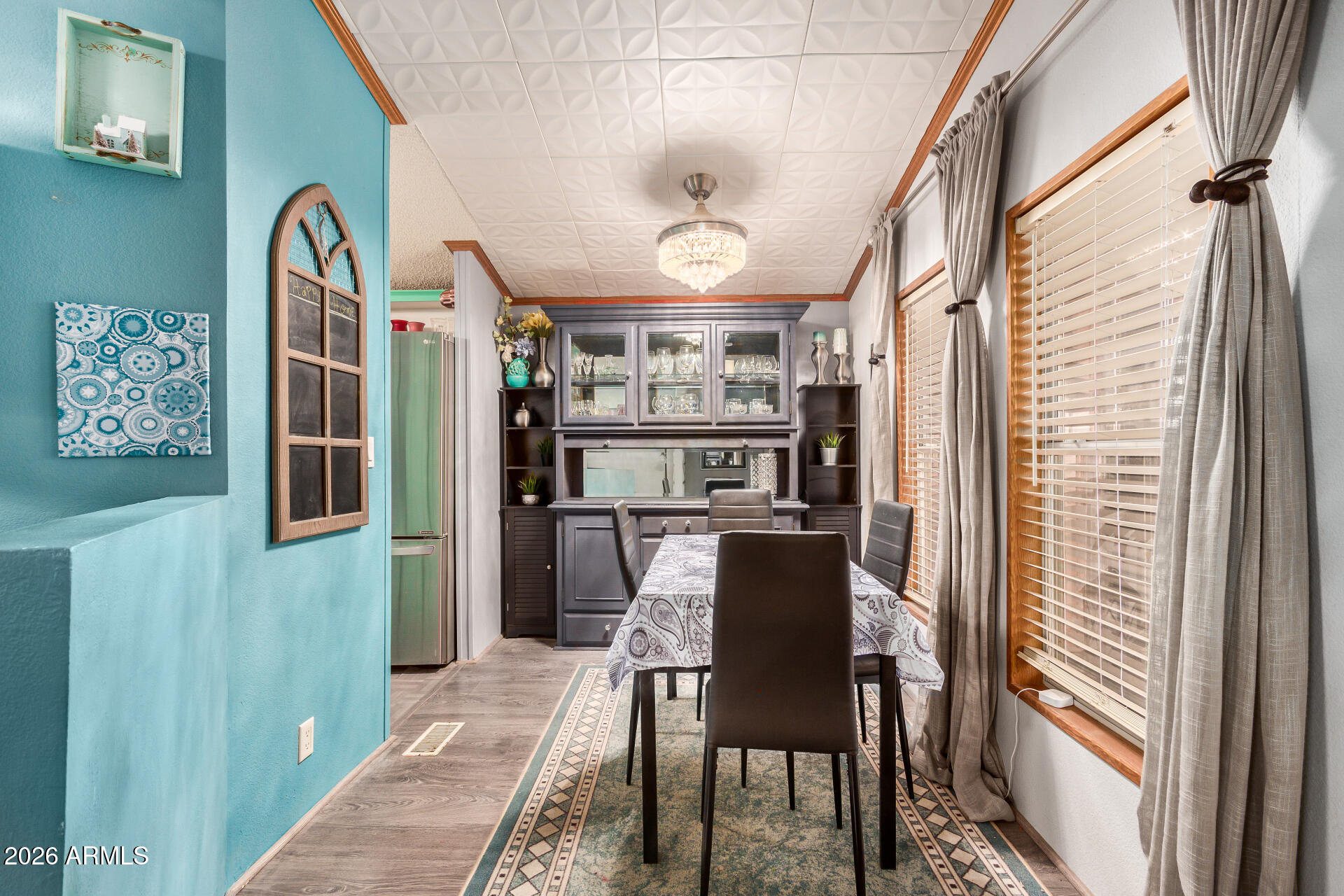 201 South Greenfield Road, Unit 239 Mesa, AZ 85206 - Photo 14 of 32 a view of a dining room with furniture window and wooden floor