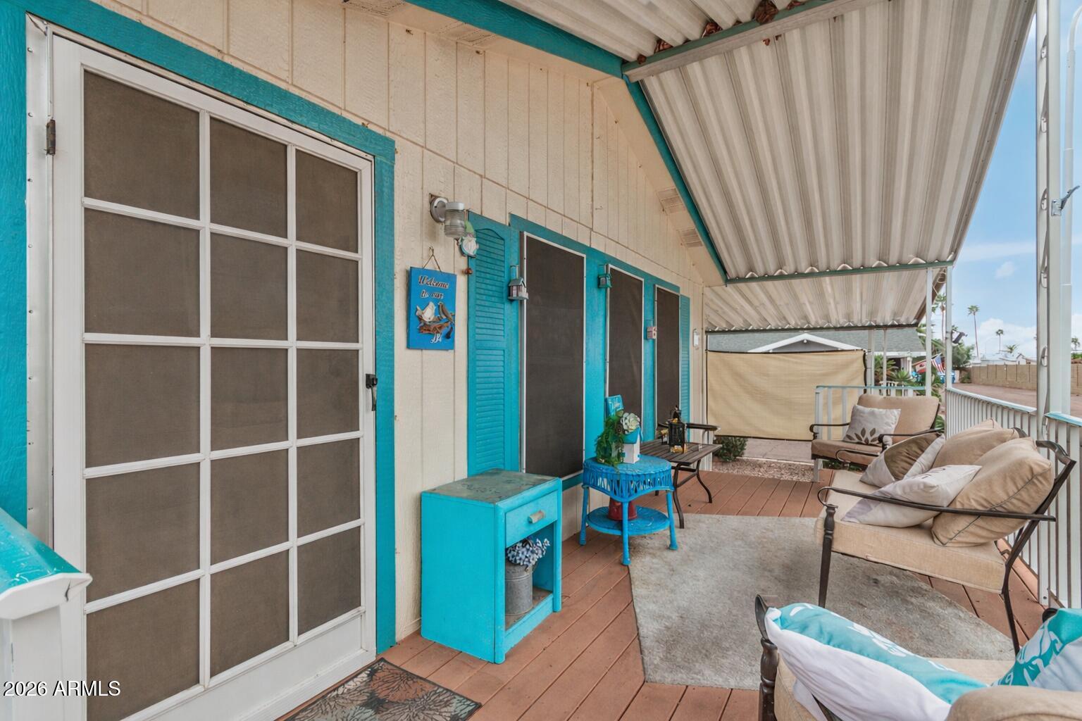 201 South Greenfield Road, Unit 239 Mesa, AZ 85206 - Photo 2 of 32 a outdoor space with patio the couches and a potted plant on a table