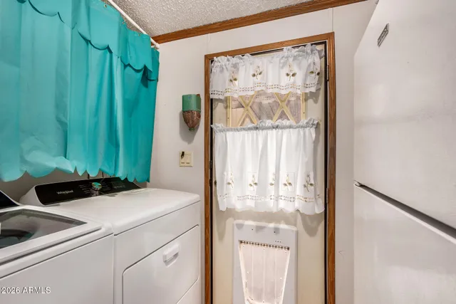 a view of kitchen with washer and dryer