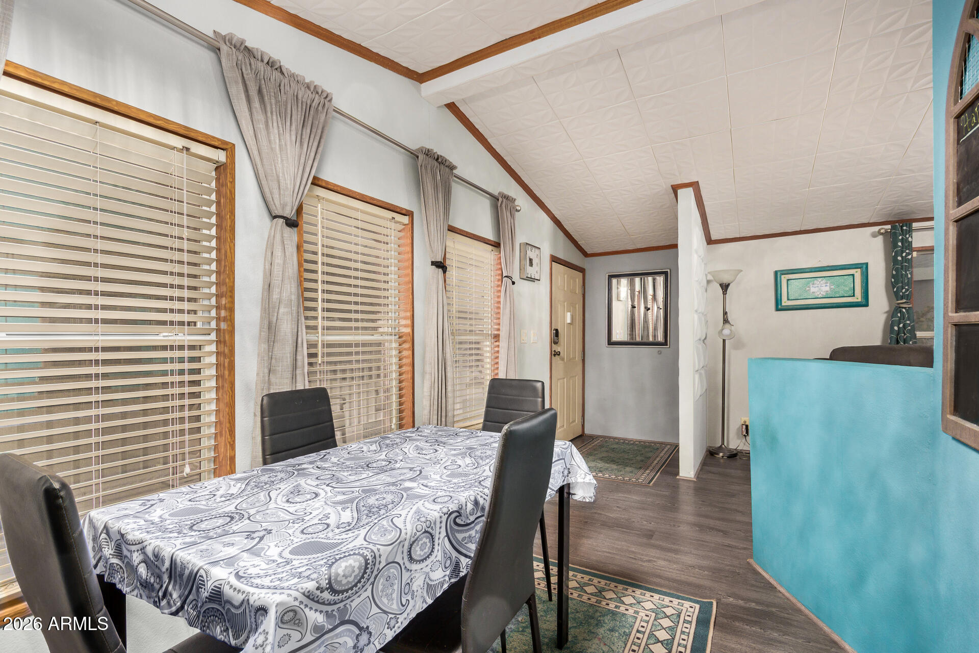 201 South Greenfield Road, Unit 239 Mesa, AZ 85206 - Photo 4 of 32 a view of a dining room with furniture and wooden floor