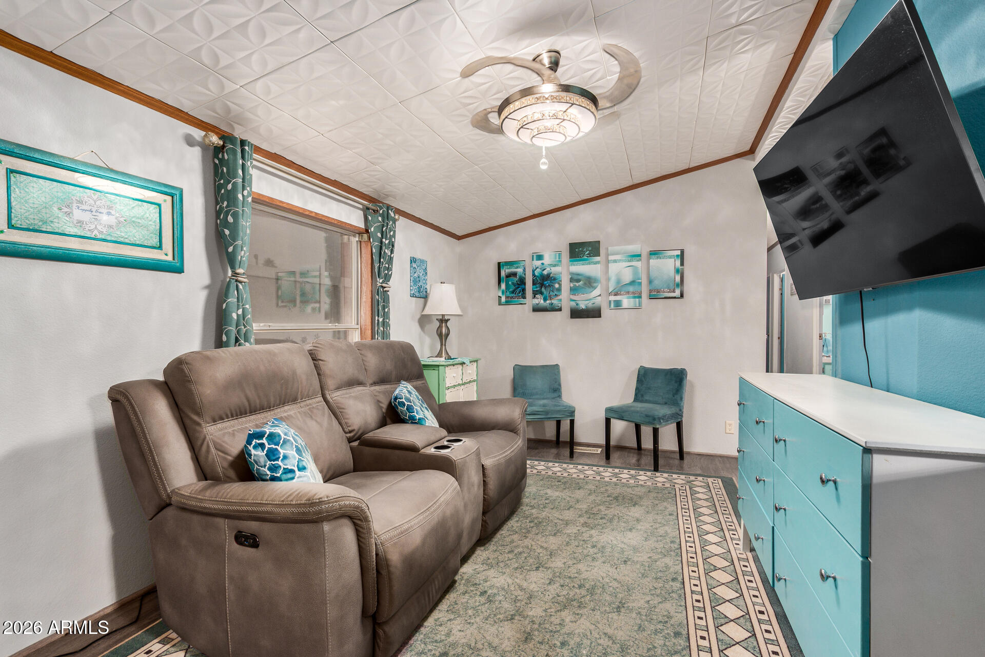 201 South Greenfield Road, Unit 239 Mesa, AZ 85206 - Photo 5 of 32 a living room with furniture and a flat screen tv