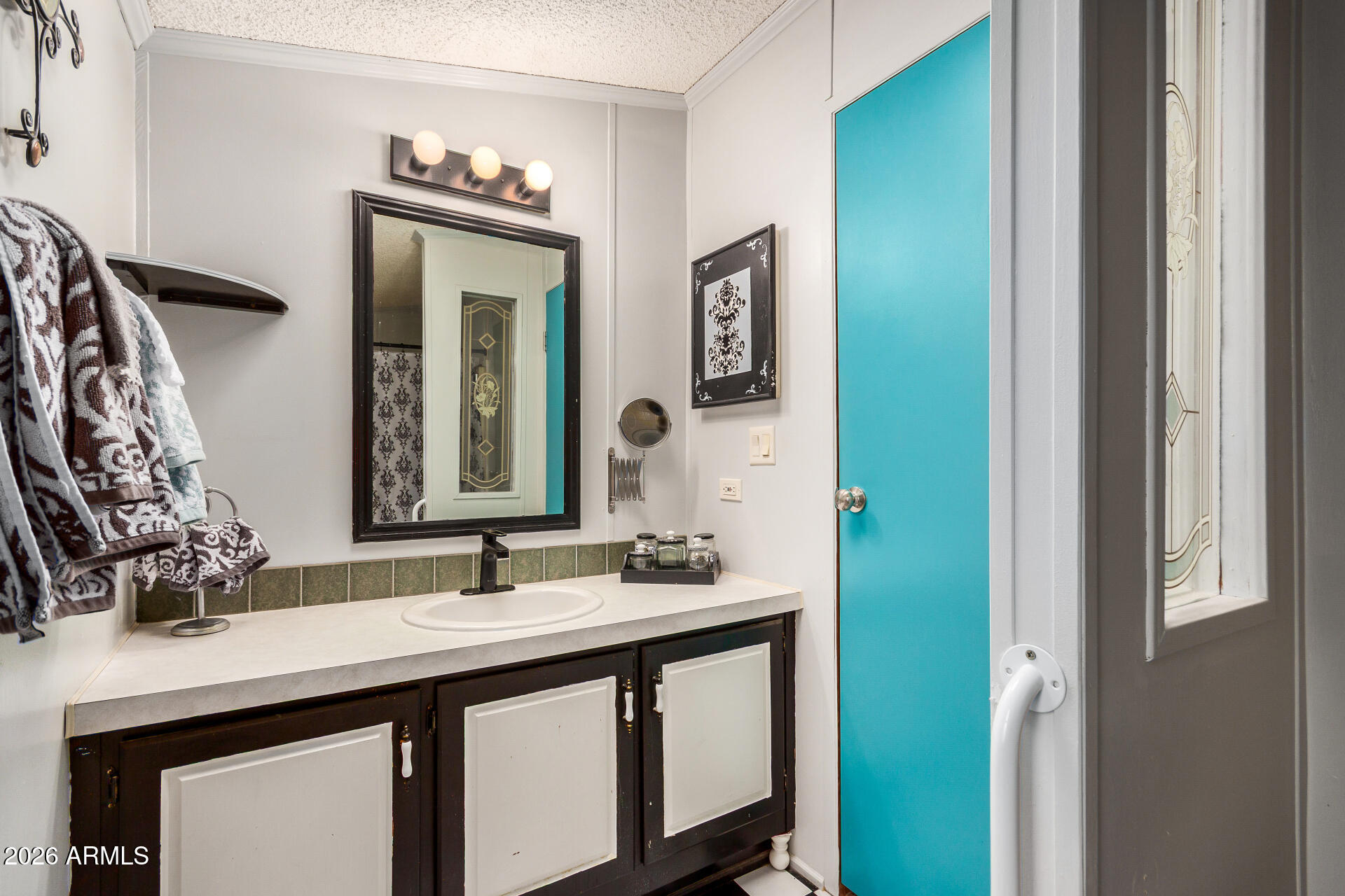 201 South Greenfield Road, Unit 239 Mesa, AZ 85206 - Photo 7 of 32 a bathroom with a sink and a mirror