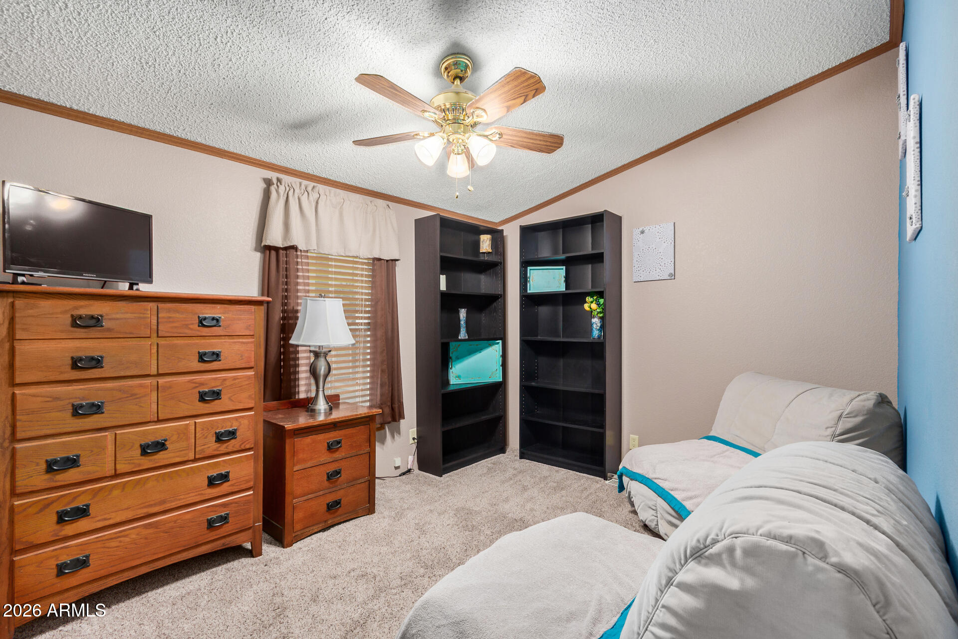 201 South Greenfield Road, Unit 239 Mesa, AZ 85206 - Photo 8 of 32 a bedroom with a bed and a flat screen tv
