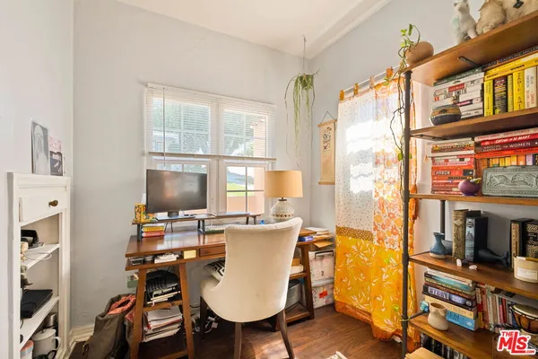 a workspace with furniture and a window