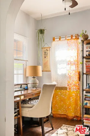 a workspace with furniture and window