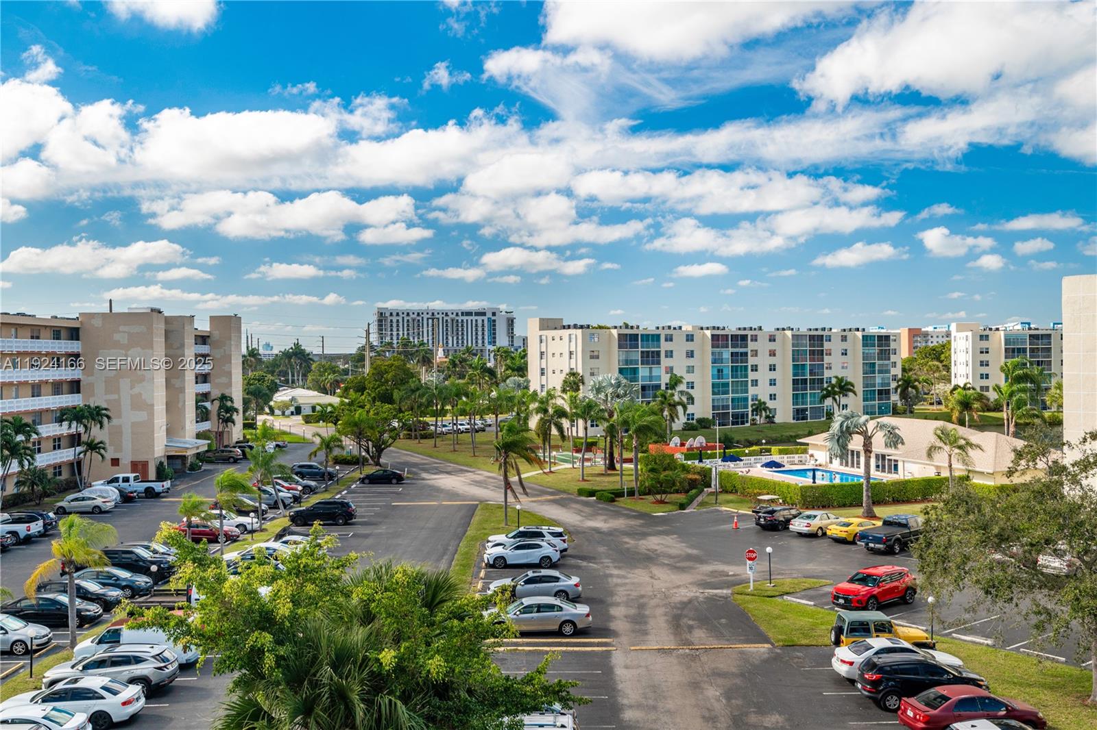 401 Southeast 3rd Street, Unit 507 Dania Beach, FL 33004 - Photo 28 of 28 a view of a patio with dining table and chairs