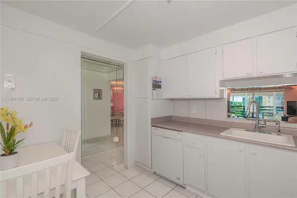 a kitchen with a sink and cabinets