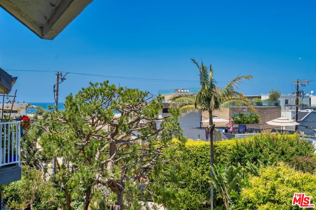 24 Westwind Street, Unit F Marina del Rey, CA 90292 - Photo 11 of 24 a view of a chairs and table in a backyard