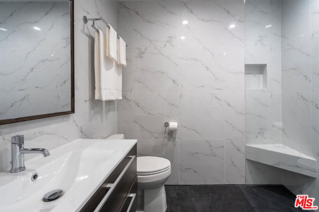 24 Westwind Street, Unit F Marina del Rey, CA 90292 - Photo 20 of 24 a bathroom with a sink toilet and shower