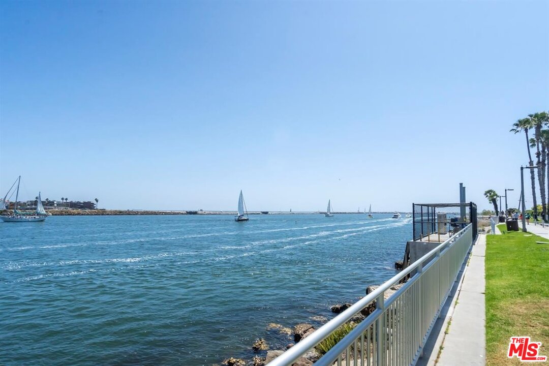 24 Westwind Street, Unit F Marina del Rey, CA 90292 - Photo 22 of 24 a view of a lake with a large bridge