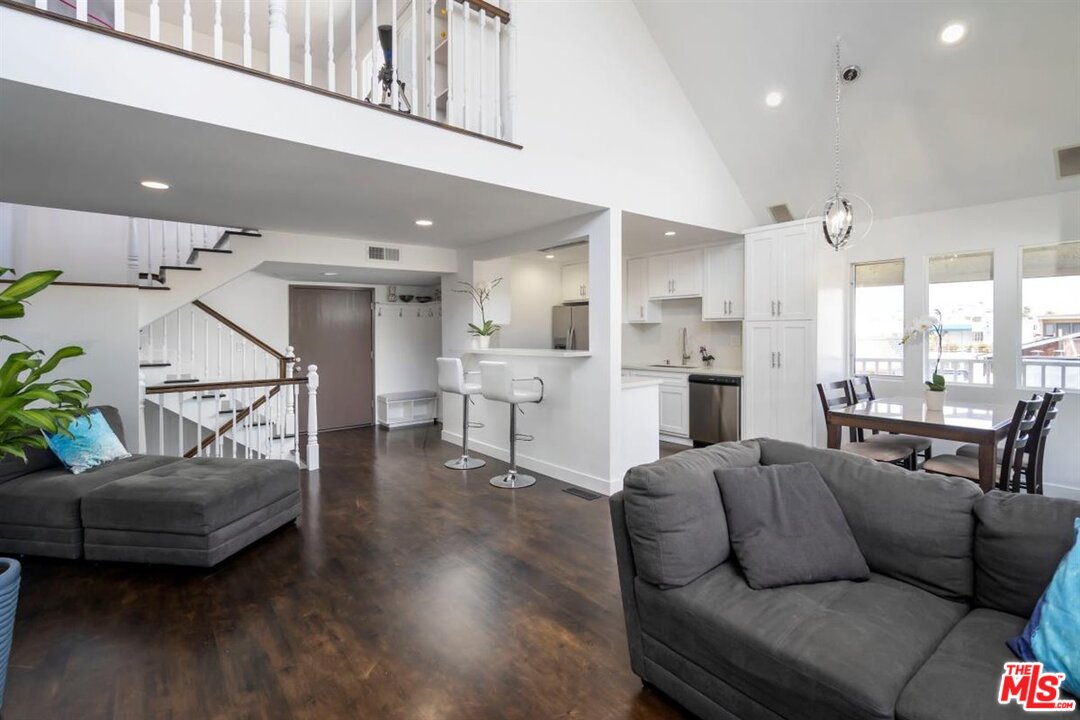 24 Westwind Street, Unit F Marina del Rey, CA 90292 - Photo 6 of 24 a living room with furniture and a view of kitchen