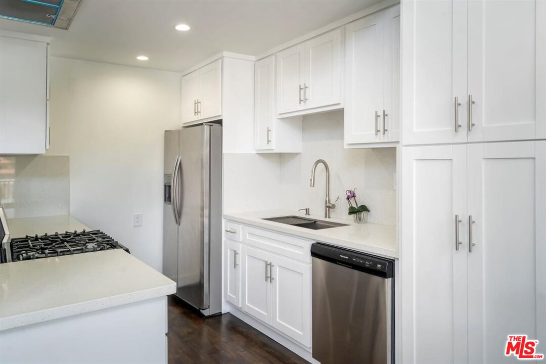 24 Westwind Street, Unit F Marina del Rey, CA 90292 - Photo 8 of 24 a kitchen with a sink stove and refrigerator
