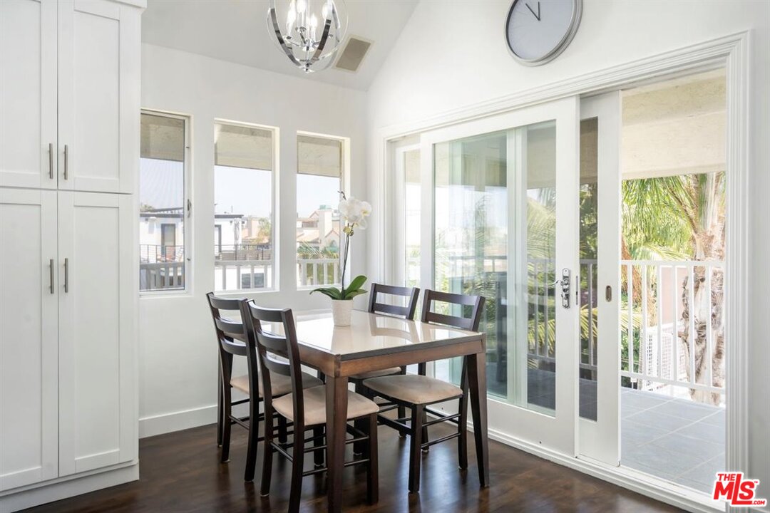 24 Westwind Street, Unit F Marina del Rey, CA 90292 - Photo 9 of 24 a view of a dining room with furniture window and wooden floor